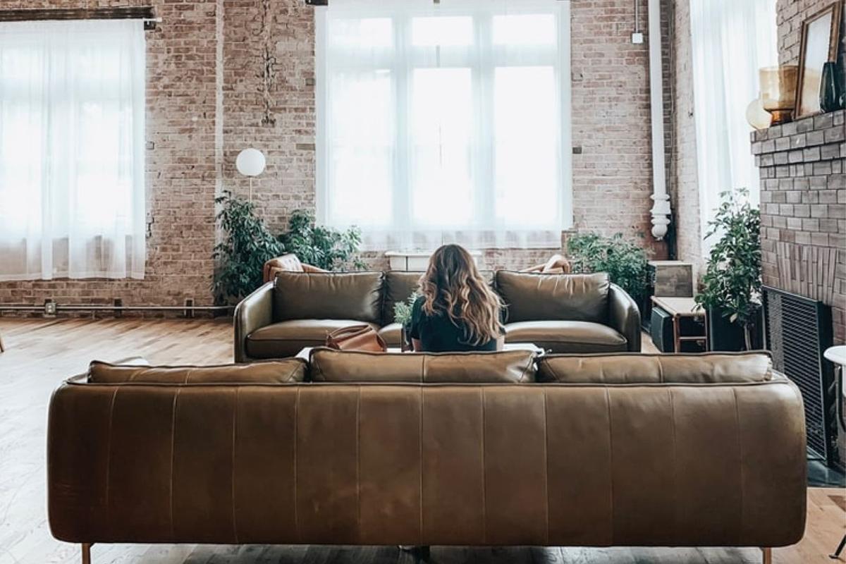 Customer relaxing at home in a bright living room